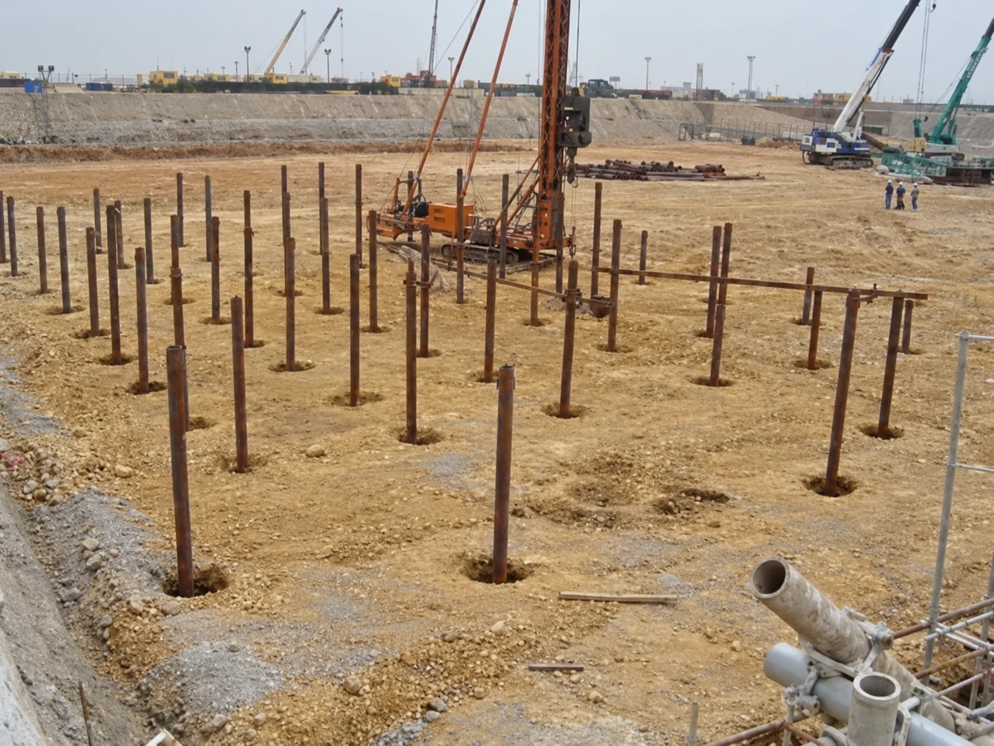 Installed steel foundation piles on a construction site